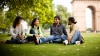 Four young Peruvians resting in the grass